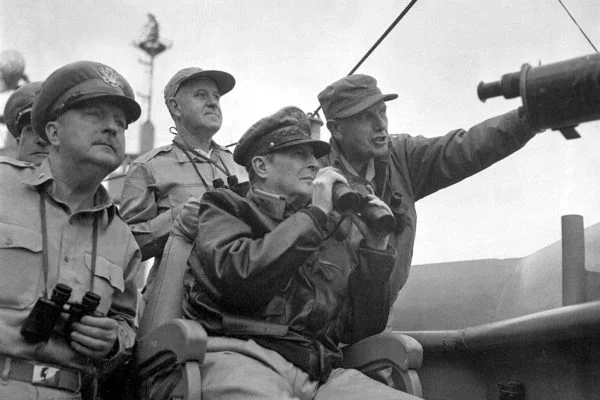 General Douglas MacArthur observes naval shelling of Incheon, 1950